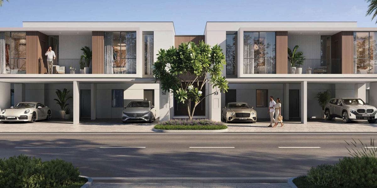 Front elevation of the ALVA townhouses at The Valley by Emaar, with covered parking under the first-floor terraces.