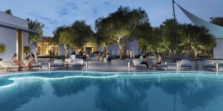 Swimming pool and shaded terrace at the ALVA community pavilion, The Valley.