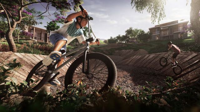 Riders on the mountain bike pump track at Athlon.