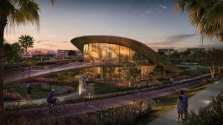 The signature clubhouse with its curved roof at the entrance to Athlon.