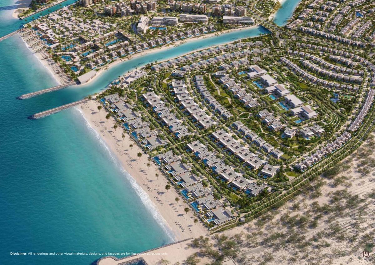 Aerial view of the Y Views enclave at BAYN Ghantoot, with beachfront villas stepping up the hillside above the Arabian Gulf.
