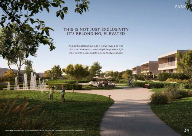 Landscaped park at Y Views with water features, walking paths and villas beyond.