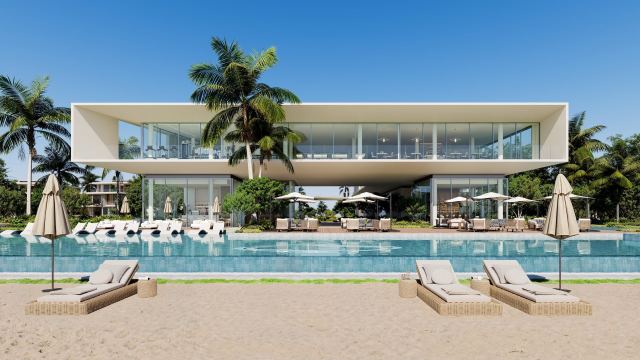 The Bay Estate beach club with its pool and sun loungers on the sand