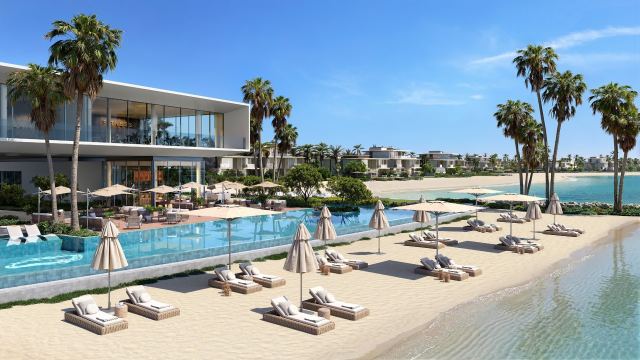 Infinity pool and loungers at the Bay Estate beach club