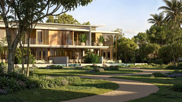 A 6-plex townhouse building with lawns in front at Bay Estate