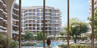 The Beach House towers framed by an arch on the podium level.