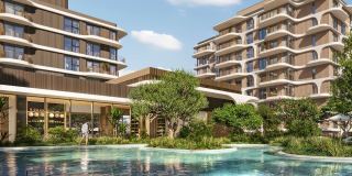 A resort-style pool on the podium at The Beach House Fahid, set among the gardens.