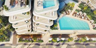 The podium and its pools at Fahid Beach Residences from above.