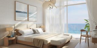 A bedroom at Fahid Beach Residences looking out to the sea.