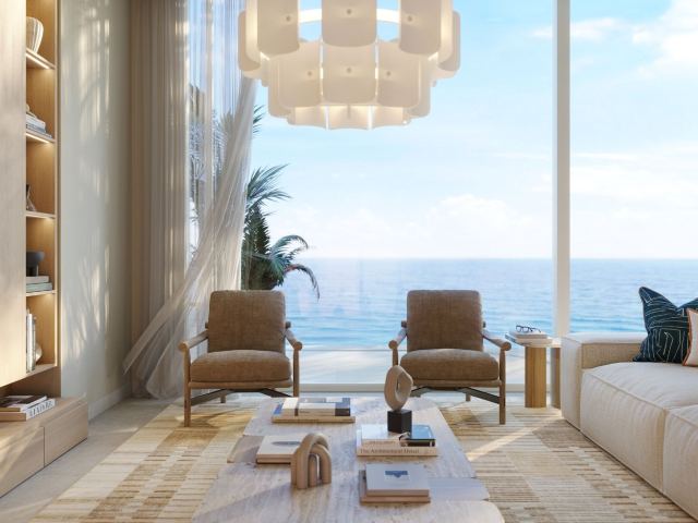 A living room at Fahid Beach Terraces, with the sea in the window.