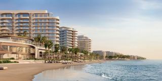 Fahid Beach Terraces from the waterfront, with the beach in front of the towers.