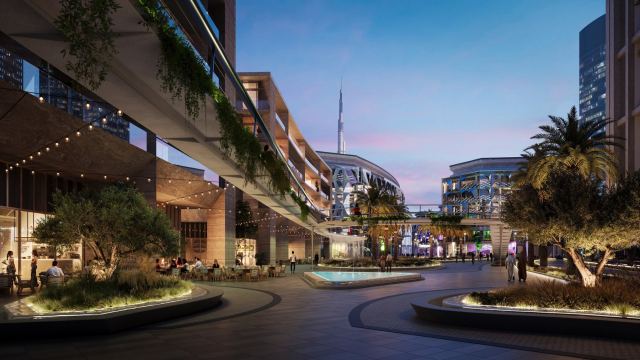 Evening plaza at Design HQ, Dubai Design District, with a central water feature and café terraces
