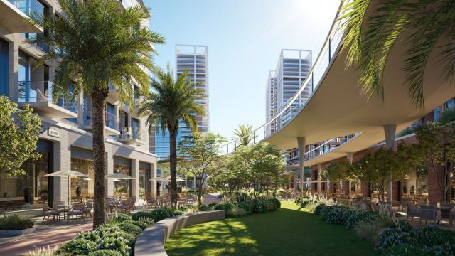Palm-lined street at Design HQ, d3, with its shaded canopy, open lawn and retail colonnade