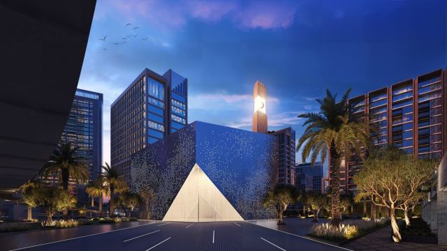 The Mindspace at d3 at night, with its lit pavilion and creative workspaces