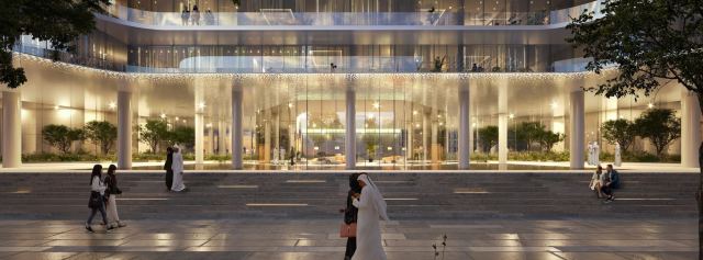 The ground-floor colonnade at Dubai Harbour Residences lit at dusk.