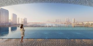 Rooftop infinity pool at Dubai Harbour Residences looking across the harbour to the Dubai skyline.