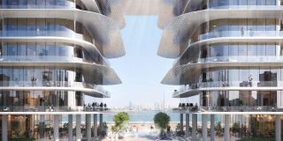 The wings of Dubai Harbour Residences framing an open view to the Gulf.