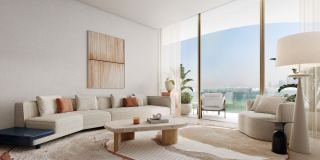 Living room at Dubai Harbour Residences opening to a terrace above the beach.