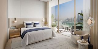Master bedroom at Dubai Harbour Residences with views over the marina.