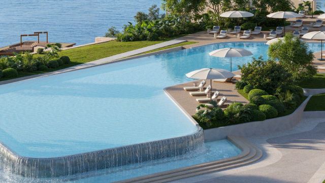 A waterfront pool deck at Dubai Maritime City looking out to the sea