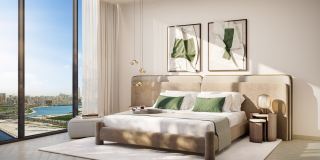 A bedroom at The Edit at d3 with the canal beyond the glass.