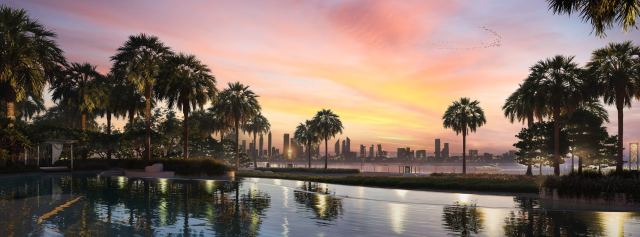 The water at The Edit at d3 at sunset, with the Dubai skyline beyond.