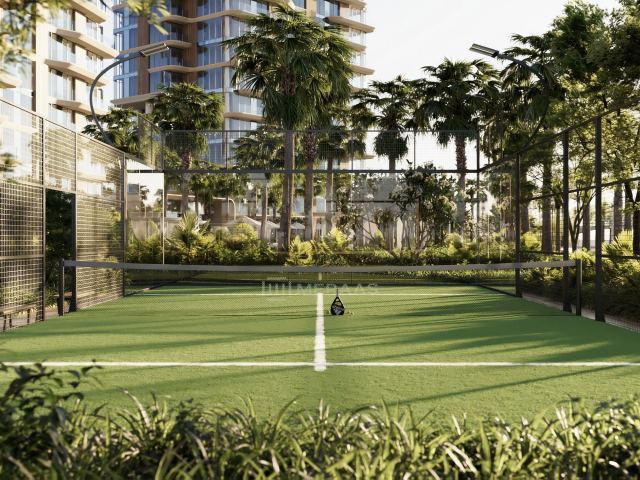 The lawn and padel court in the landscaped deck at The Edit at d3.