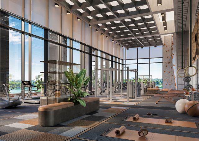 Gym at Eltiera Views, with strength and cardio zones and a climbing wall.