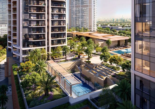 Podium deck at Eltiera Views, with the pools and landscaped spine linking the towers.