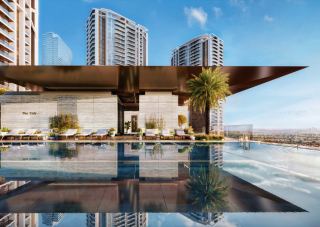 Adult infinity lap pool at Eltiera Views, overlooking the Dubai skyline.