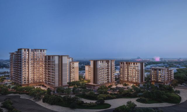 Expo Valley Views apartment buildings at dusk above the Expo Valley landscape