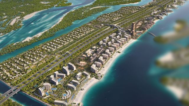 Fahid Island from the air, the beach along its outer edge and the homes behind it
