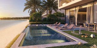 Pool and sun terrace at a Beach Collection villa, Frond F.