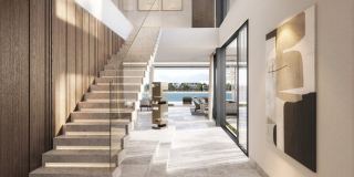Floating staircase and entrance hall inside a Frond F villa.