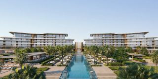 Residence façades framing the central pool at Saadiyat Beach