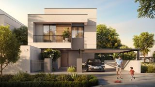 A four bedroom villa and its garden at Al Ghadeer Gardens.