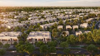 Al Ghadeer Gardens seen from the air, with the townhouse streets and gardens.