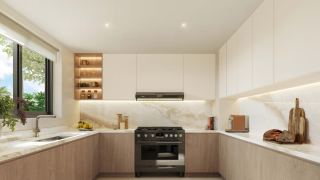 A kitchen at Al Ghadeer Gardens in the light palette.