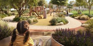 Tree-lined pathways and planted gardens at Al Ghadeer Parks.