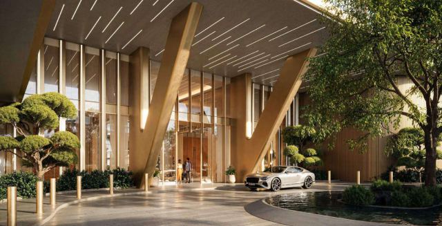 Arrival drop-off at HADO, with its sculptural canopy and water feature.