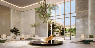 Lobby at HADO, with sculpted stone and a central tree.