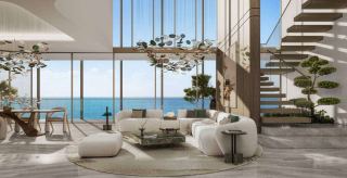 Duplex living area at HADO, with sea views and an open staircase.