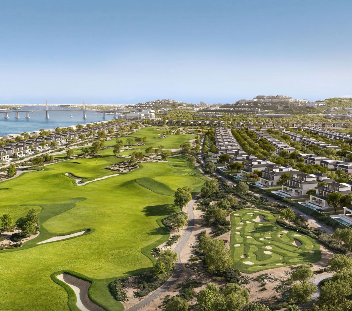 Aerial view of the 18-hole course at Hudayriyat Golf Estates with villa neighbourhoods along the fairways.