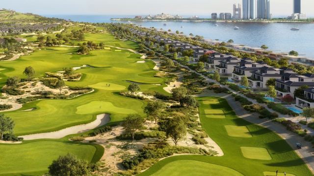 The golf course at Hudayriyat Golf Estates, with the Abu Dhabi skyline across the water