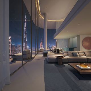 Living space in a five-bedroom duplex Sky Villa at Inaura facing the Burj Khalifa.