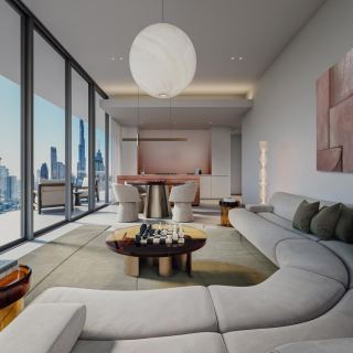 Living room in a two-bedroom residence at Inaura with a curved sofa.