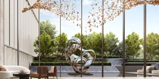 The double-height lobby at Jumeirah Residences Emirates Towers, opening onto the gardens.