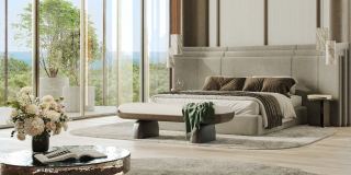 A bedroom at Kanyon with floor-to-ceiling windows onto the greenery and the sea.