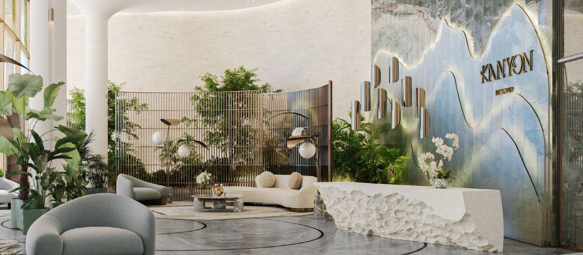 The grand lobby at Kanyon by Beyond, planted and wrapped in stone and glass.