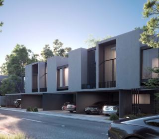 Townhouse street elevation at Masaar 3, with covered parking.